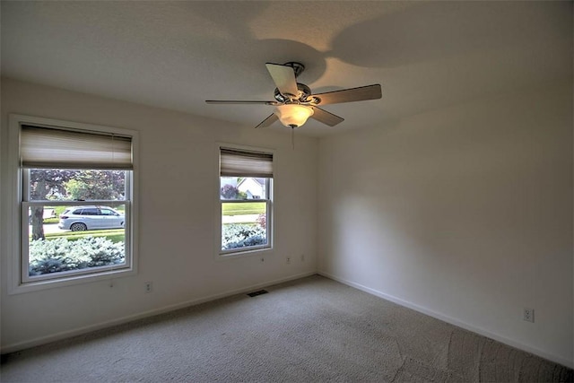1310 Country Ln, Mt Zion, IL 62549 - spare room featuring light carpet and ceiling fan