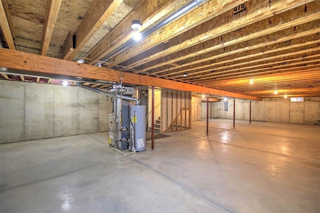 1310 Country Ln, Mt Zion, IL 62549 - unfinished basement featuring gas water heater and stairs