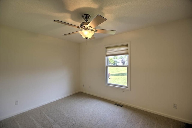 1310 Country Ln, Mt Zion, IL 62549 - spare room with carpet floors, a ceiling fan, and a textured ceiling
