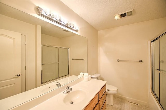1310 Country Ln, Mt Zion, IL 62549 - bathroom featuring vanity, a textured ceiling, and shower / bath combination with glass door