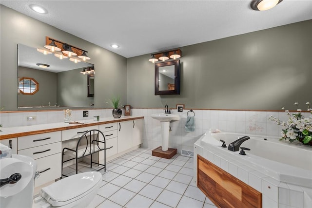 14480 N 1025th St, Effingham, IL 62401 - full bath featuring a garden tub, tile patterned floors, tile walls, and a wainscoted wall