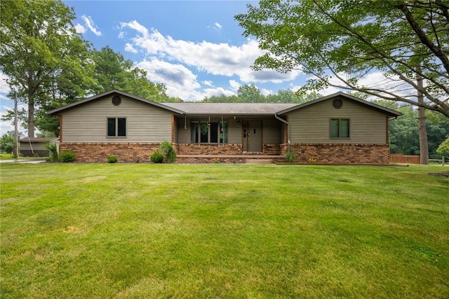 14480 N 1025th St, Effingham, IL 62401 - ranch-style house featuring brick siding, a front lawn, and covered porch