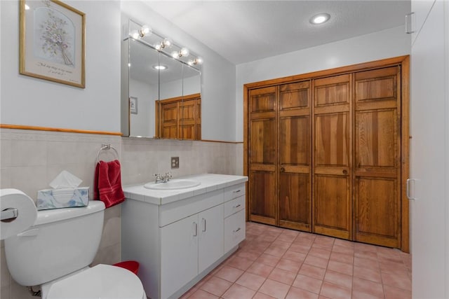 14480 N 1025th St, Effingham, IL 62401 - bathroom featuring tile walls, vanity, tile patterned floors, and a wainscoted wall
