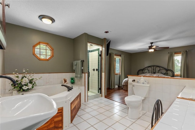 14480 N 1025th St, Effingham, IL 62401 - bathroom with a bath, a stall shower, tile patterned flooring, and ceiling fan