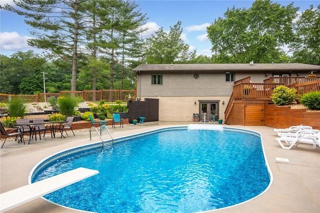 14480 N 1025th St, Effingham, IL 62401 - view of pool featuring stairs, a wooden deck, a diving board, a patio area, and french doors