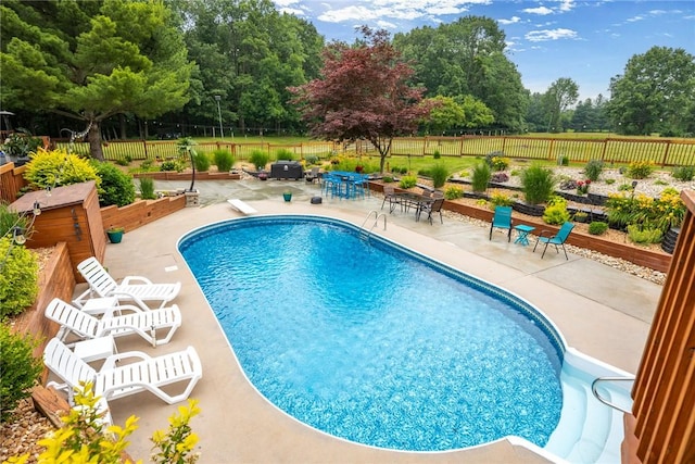14480 N 1025th St, Effingham, IL 62401 - view of swimming pool featuring a patio, a fenced backyard, and view of scattered trees
