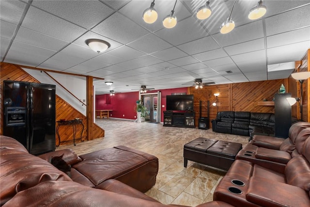 14480 N 1025th St, Effingham, IL 62401 - living area with wood walls, stairway, a ceiling fan, and a paneled ceiling