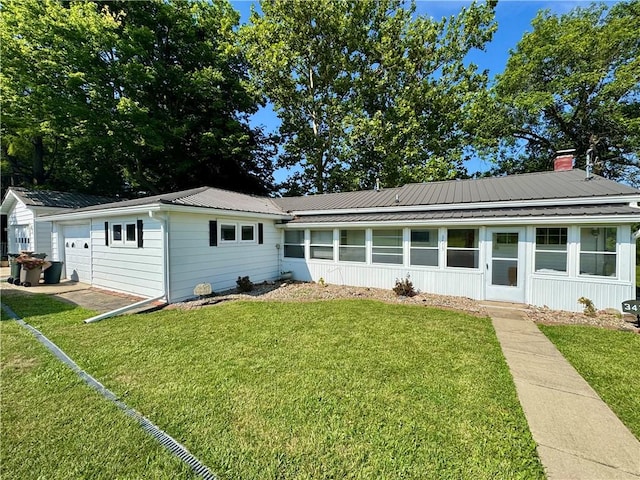 3475 Lake Paradise Rd, Mattoon, IL 61938 - view of front of property with a metal roof, a front lawn, and a chimney