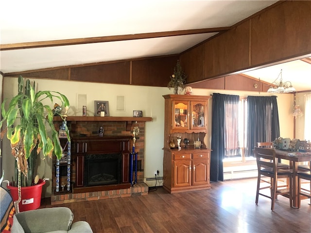 living room featuring a baseboard heating unit, a fireplace, vaulted ceiling with beams, and wood finished floors