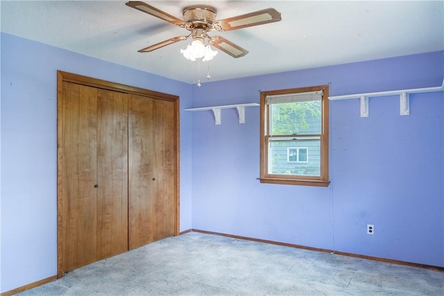 702 N Oakwood St, Effingham, IL 62401 - unfurnished bedroom with carpet flooring, baseboards, ceiling fan, and a closet