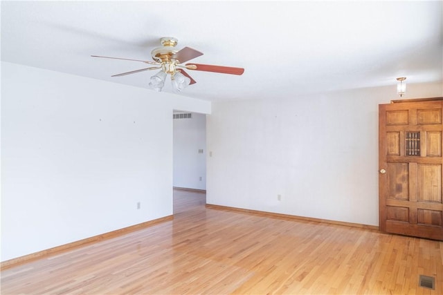 702 N Oakwood St, Effingham, IL 62401 - spare room featuring ceiling fan, visible vents, baseboards, and light wood-style floors