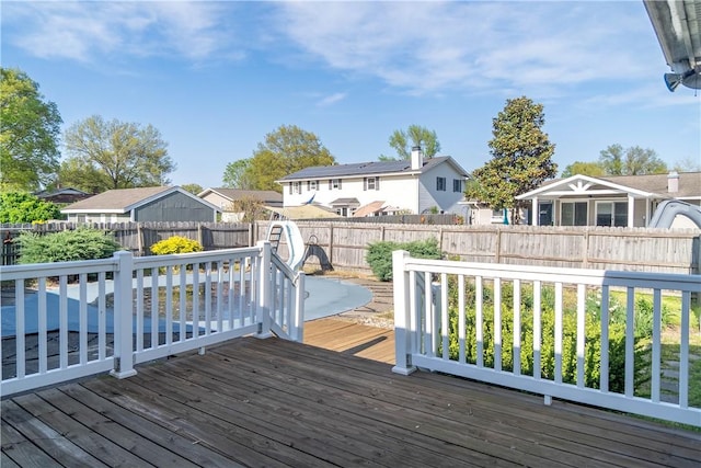 702 N Oakwood St, Effingham, IL 62401 - wooden deck featuring a fenced backyard and a residential view