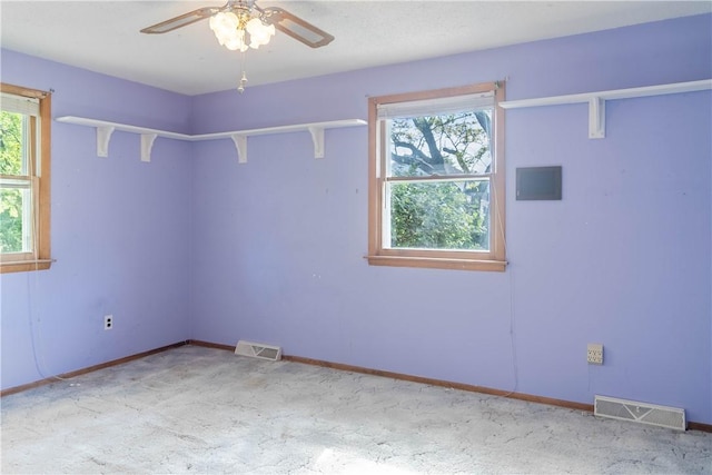 702 N Oakwood St, Effingham, IL 62401 - carpeted spare room featuring visible vents, a ceiling fan, and baseboards