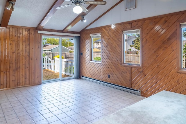 702 N Oakwood St, Effingham, IL 62401 - spare room featuring ceiling fan, wood walls, visible vents, and baseboard heating