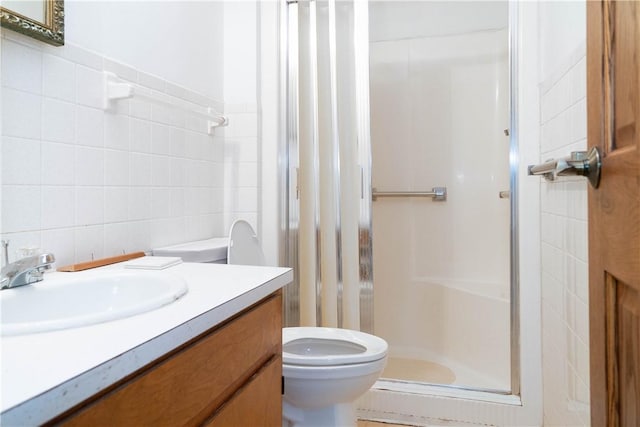 702 N Oakwood St, Effingham, IL 62401 - bathroom with a stall shower, toilet, and tile walls