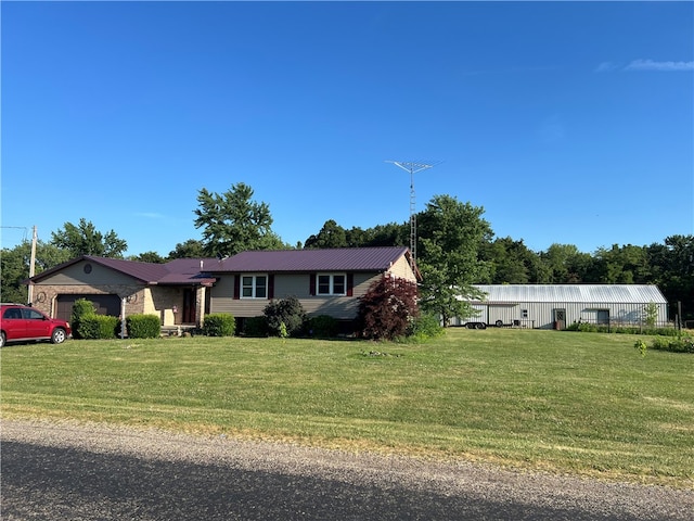 view of front facade with a garage and a front yard