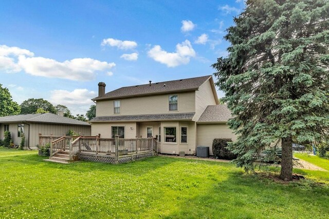 4554 Nicklaus Ct, Decatur, IL 62526 - back of house featuring central AC, a yard, and a wooden deck