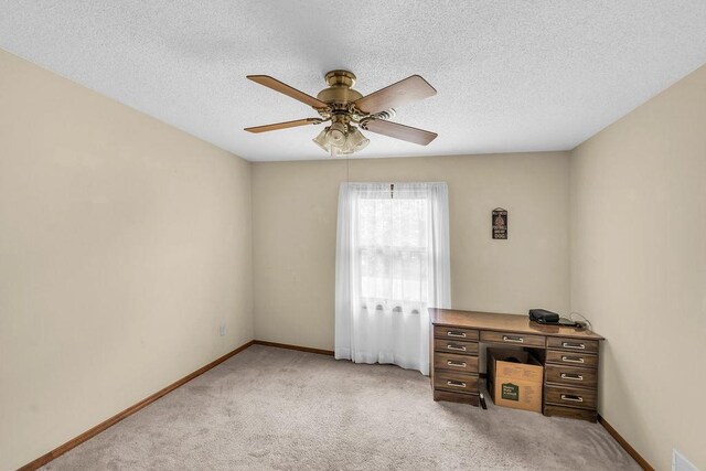 4554 Nicklaus Ct, Decatur, IL 62526 - unfurnished office with light colored carpet, ceiling fan, and baseboards