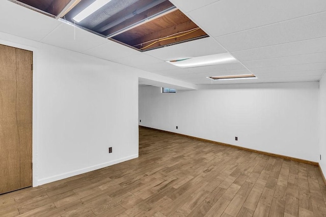 4554 Nicklaus Ct, Decatur, IL 62526 - finished basement featuring wood finished floors and baseboards