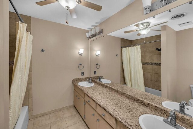 4554 Nicklaus Ct, Decatur, IL 62526 - full bathroom featuring ceiling fan, double vanity, and shower / tub combo