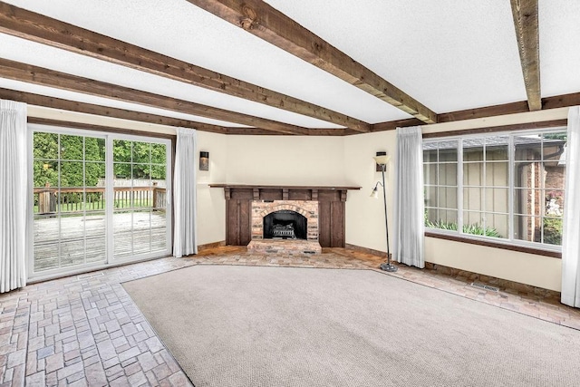 4554 Nicklaus Ct, Decatur, IL 62526 - unfurnished living room with a fireplace, beamed ceiling, and baseboards