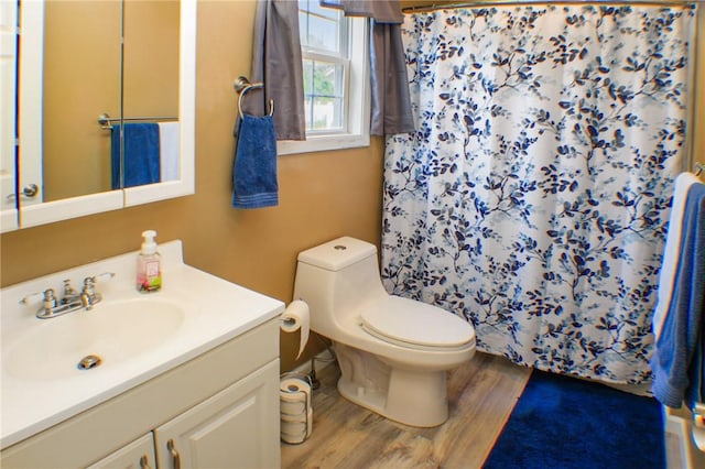 1203 Adams Ave, Charleston, IL 61920 - full bathroom featuring wood finished floors, vanity, and a shower with shower curtain
