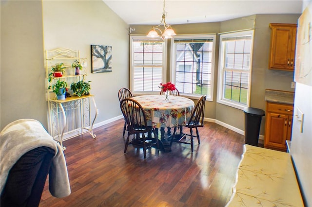 1203 Adams Ave, Charleston, IL 61920 - dining room with dark wood-style floors, a chandelier, and vaulted ceiling