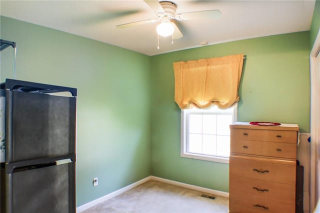 1203 Adams Ave, Charleston, IL 61920 - unfurnished bedroom featuring light colored carpet and a ceiling fan
