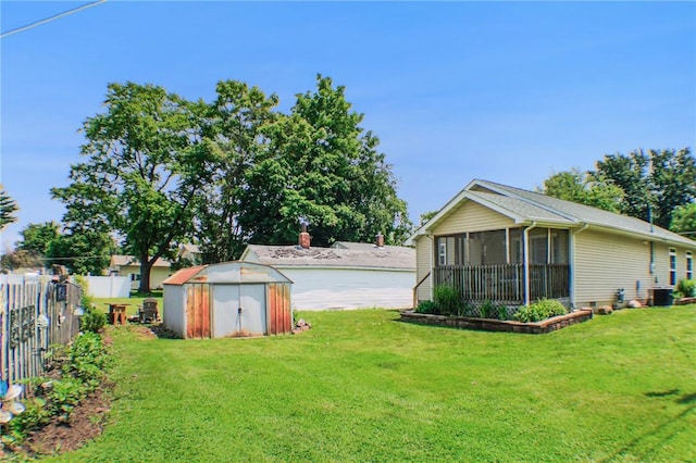 1203 Adams Ave, Charleston, IL 61920 - view of yard featuring a storage shed and a sunroom