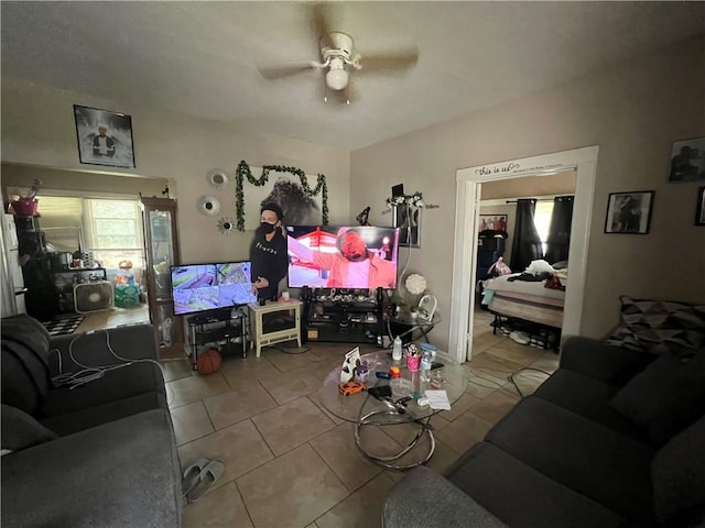 tiled living room with a ceiling fan