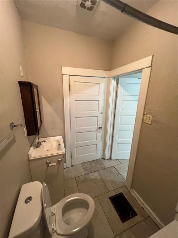 249 N 17th St, Decatur, IL 62521 - half bath featuring toilet and vanity