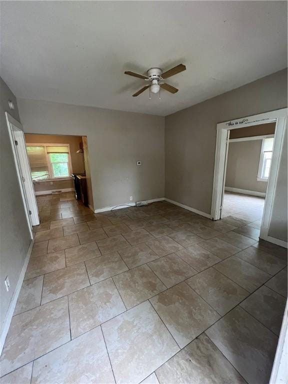 249 N 17th St, Decatur, IL 62521 - unfurnished room with a ceiling fan, baseboards, and tile patterned flooring