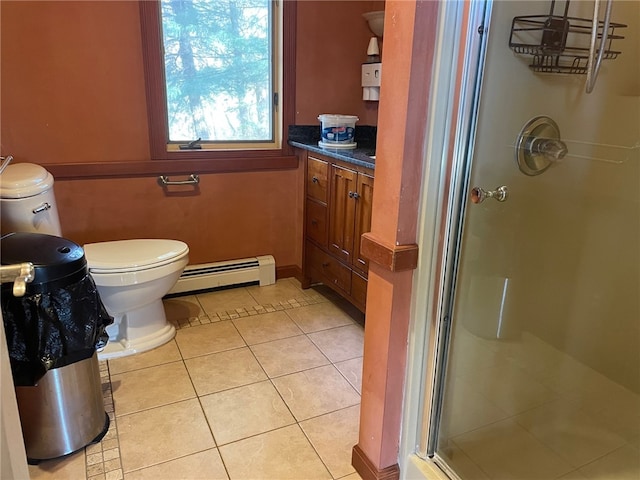 bathroom featuring a baseboard radiator, tile patterned floors, toilet, a shower with door, and vanity