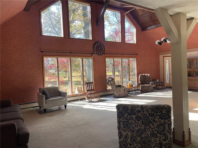 living room with carpet flooring, beamed ceiling, high vaulted ceiling, and a baseboard heating unit