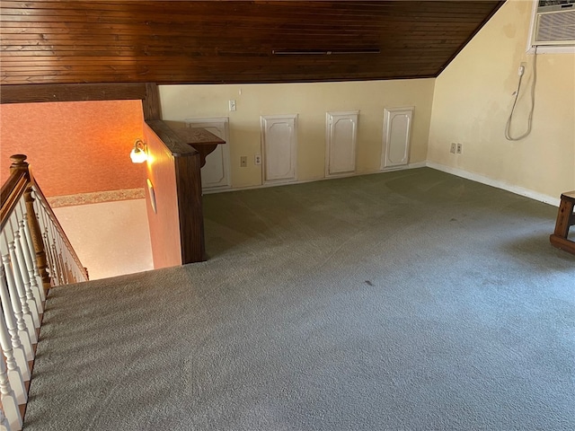 bonus room with dark colored carpet and wood ceiling