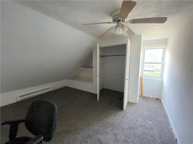 1105 Edgar Ave, Mattoon, IL 61938 - additional living space featuring a baseboard radiator, a textured ceiling, carpet, a ceiling fan, and vaulted ceiling
