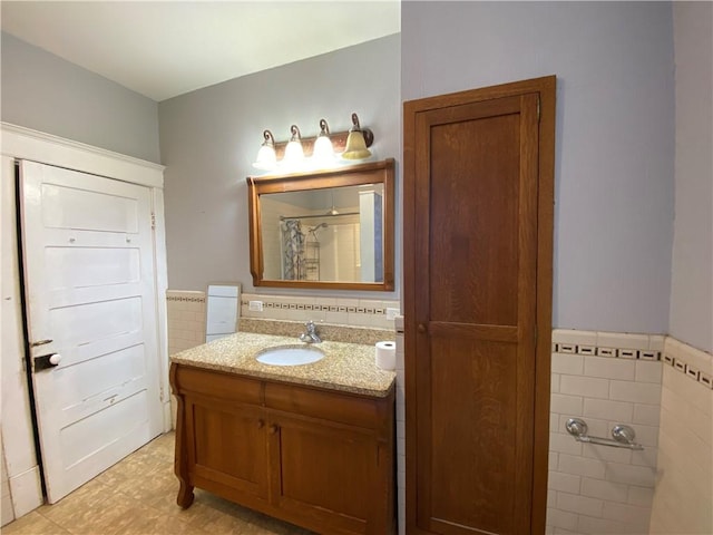 1105 Edgar Ave, Mattoon, IL 61938 - full bathroom featuring tile walls, vanity, a shower with shower curtain, and wainscoting
