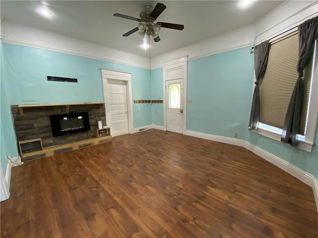 1105 Edgar Ave, Mattoon, IL 61938 - unfurnished living room featuring a fireplace, ceiling fan, and wood finished floors