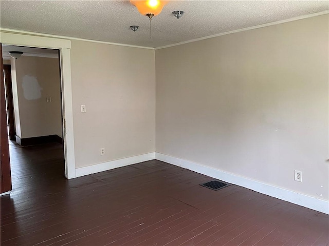 764 10th St, Charleston, IL 61920 - empty room featuring hardwood / wood-style floors, a textured ceiling, ornamental molding, and fire sprinkler in ceiling