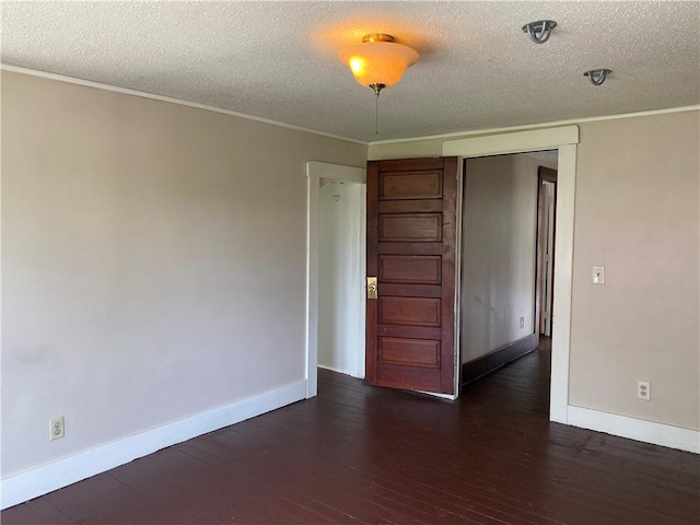 764 10th St, Charleston, IL 61920 - spare room featuring hardwood / wood-style floors, a textured ceiling, and ornamental molding