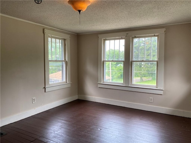 764 10th St, Charleston, IL 61920 - unfurnished room featuring healthy amount of natural light, dark wood finished floors, ornamental molding, and a textured ceiling