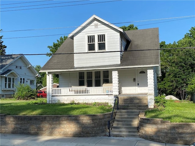 764 10th St, Charleston, IL 61920 - view of front of property featuring covered porch, a front yard, and a shingled roof