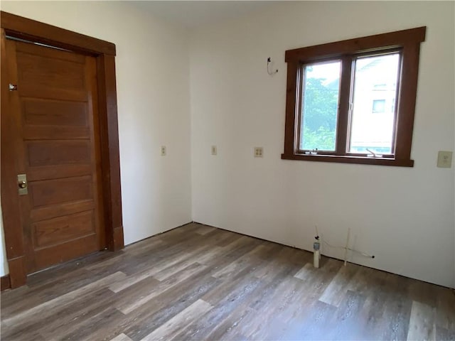 764 10th St, Charleston, IL 61920 - empty room featuring wood finished floors