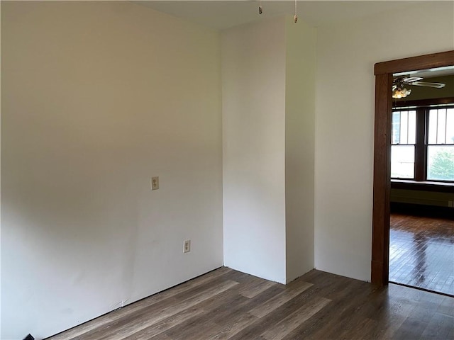 764 10th St, Charleston, IL 61920 - spare room with dark wood-style flooring and a ceiling fan
