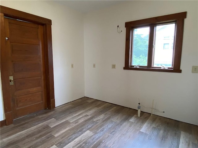 764 10th St, Charleston, IL 61920 - empty room with wood finished floors