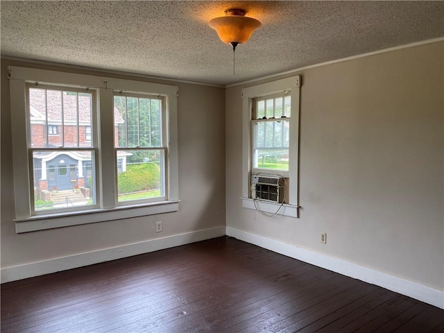 764 10th St, Charleston, IL 61920 - unfurnished room featuring plenty of natural light, dark wood-type flooring, cooling unit, a textured ceiling, and crown molding