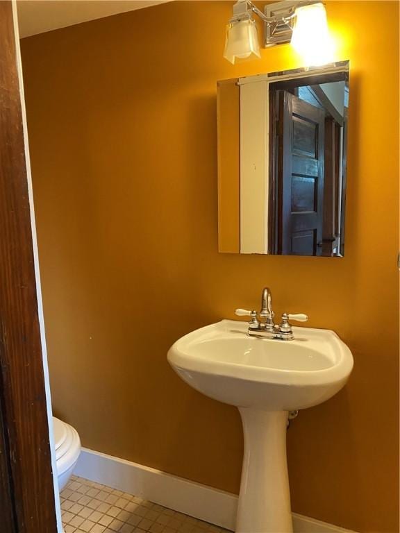 764 10th St, Charleston, IL 61920 - half bath with baseboards and toilet
