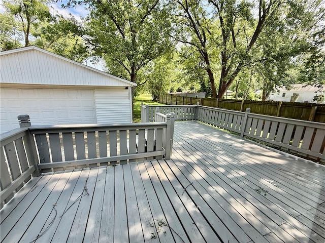 1250 S Lake Ridge Ave, Decatur, IL 62521 - wooden deck featuring a garage and an outbuilding
