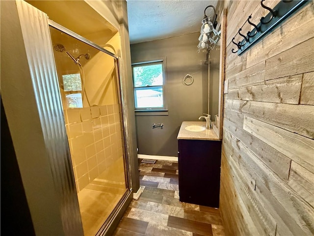 1250 S Lake Ridge Ave, Decatur, IL 62521 - full bath featuring wood walls, vanity, a shower stall, and a textured ceiling