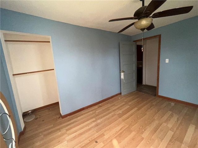 1010 S Jones St, Robinson, IL 62454 - unfurnished bedroom featuring light wood-type flooring, a closet, and ceiling fan
